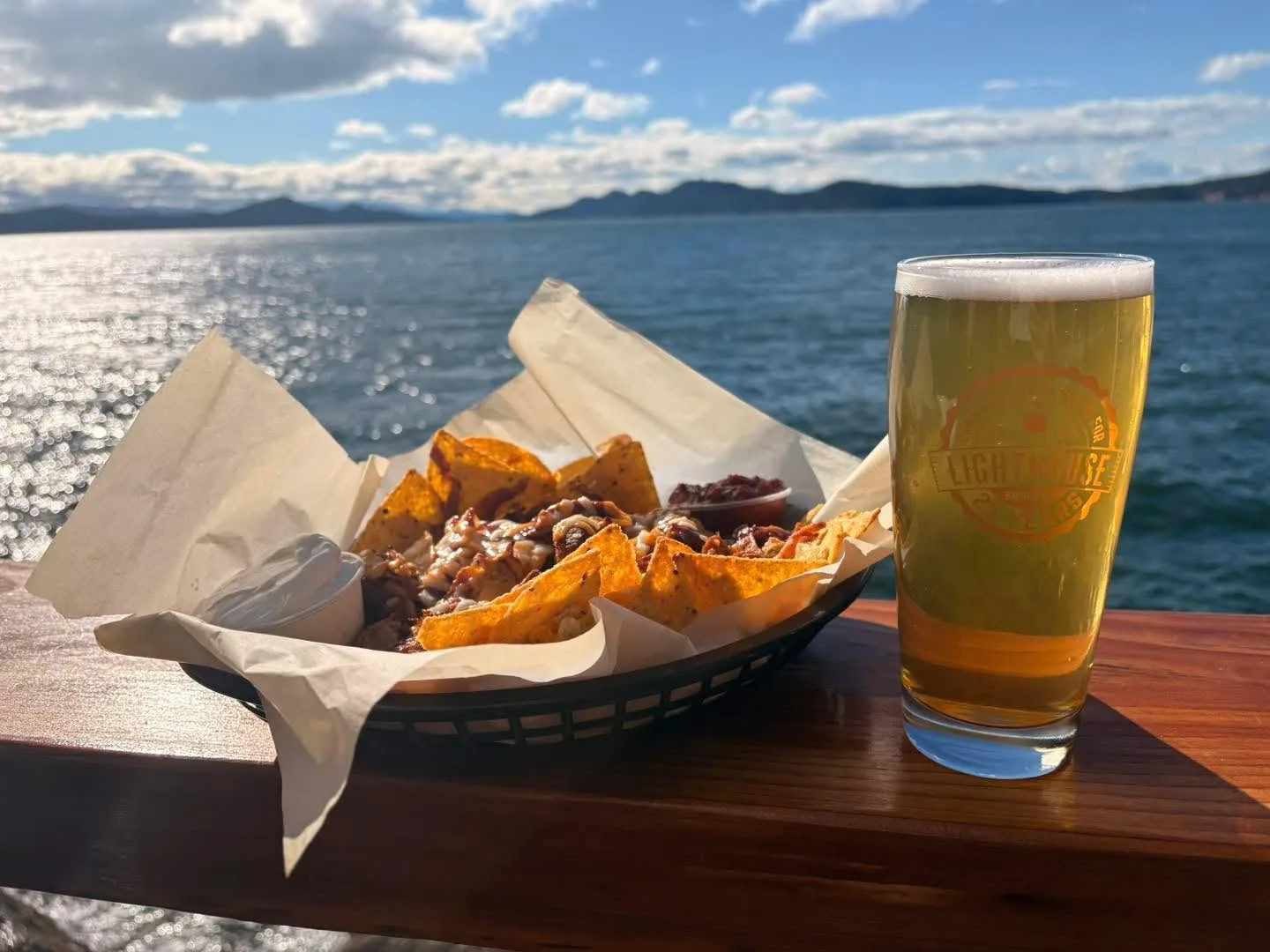 Beer and Nachos on the railing looking at the ocean